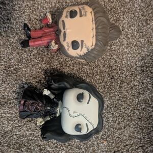 Funko Pop Figures in Red and Black Outfits